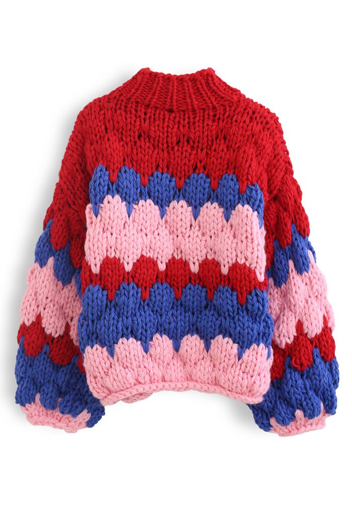 Suéter grueso tejido a mano con cuello alto con bloques de color en rojo