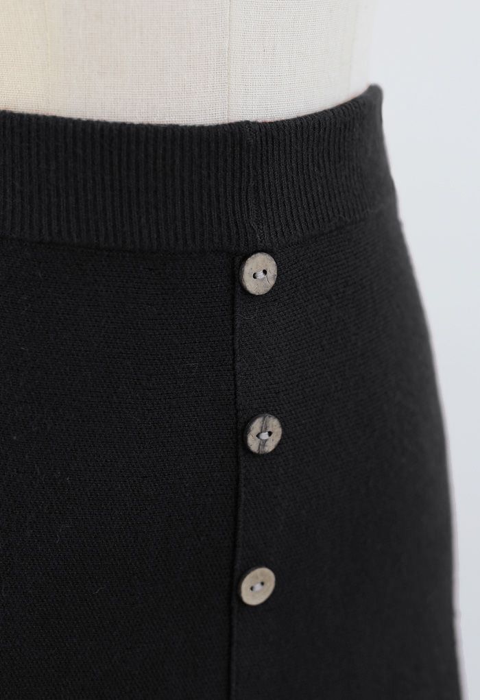 Falda midi de punto con botones y dobladillo enrollado en negro
