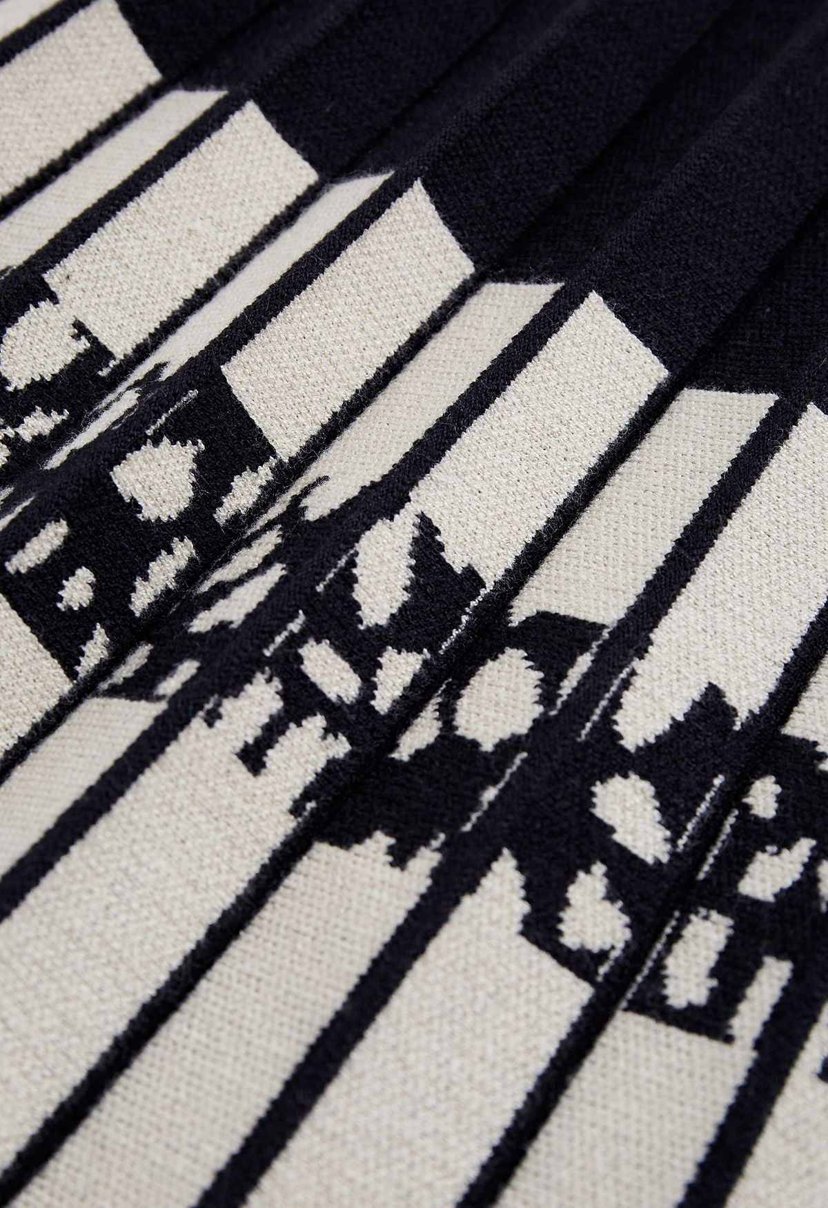 Falda de punto plisada con bloques de colores en negro