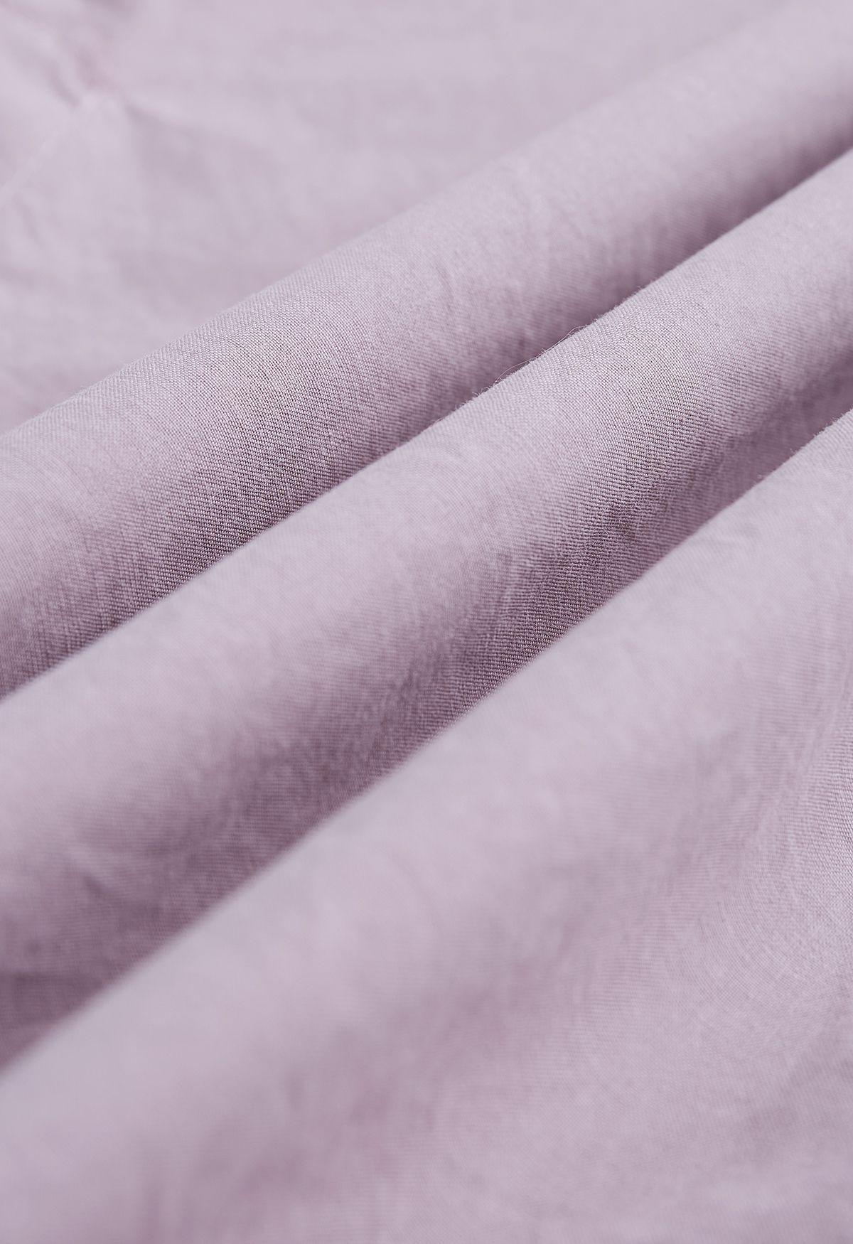 Camisa de algodón con botones y mangas con cordón en rosa polvoriento
