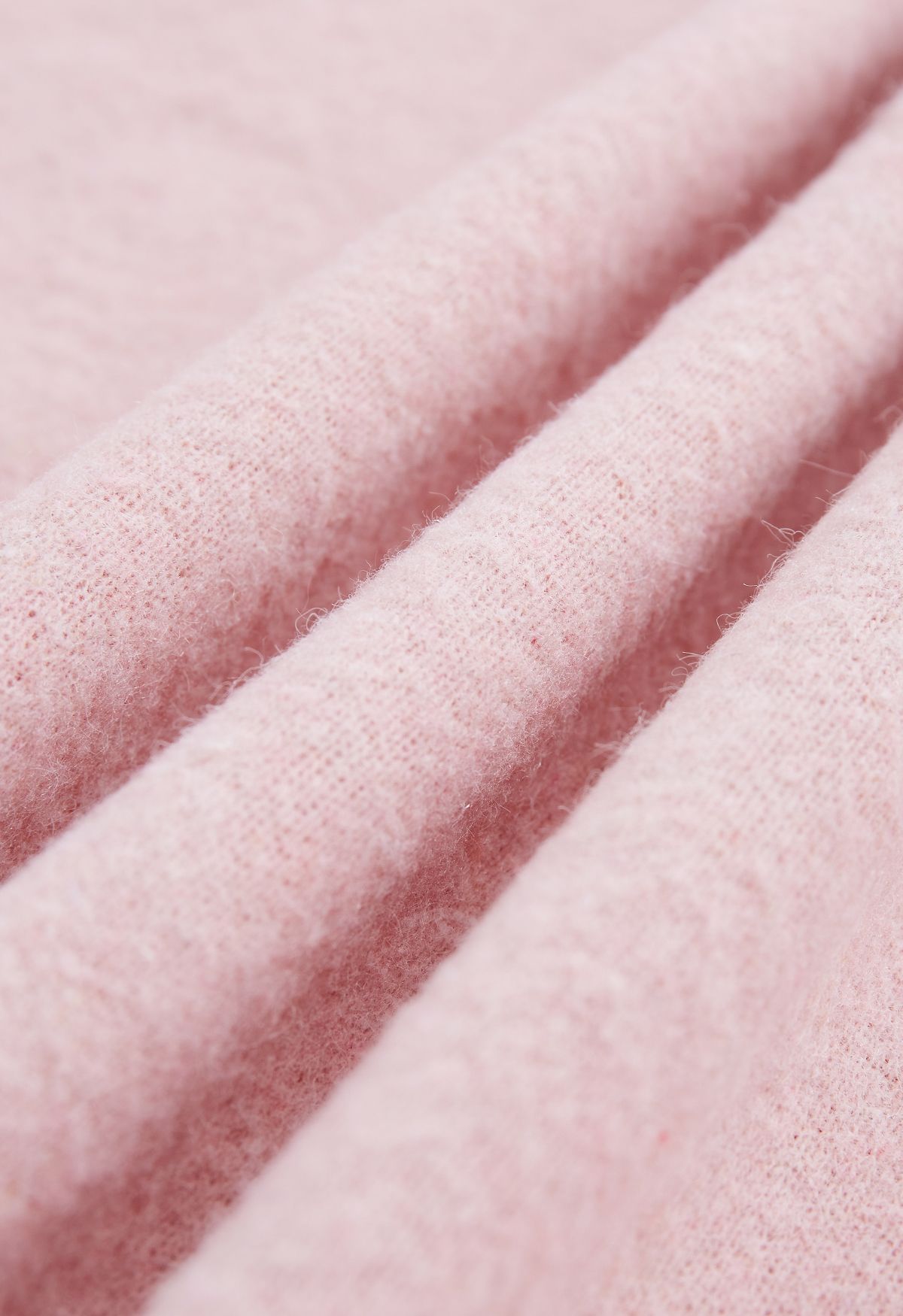 Poncho de piel sintética con lazo y lazo en rosa