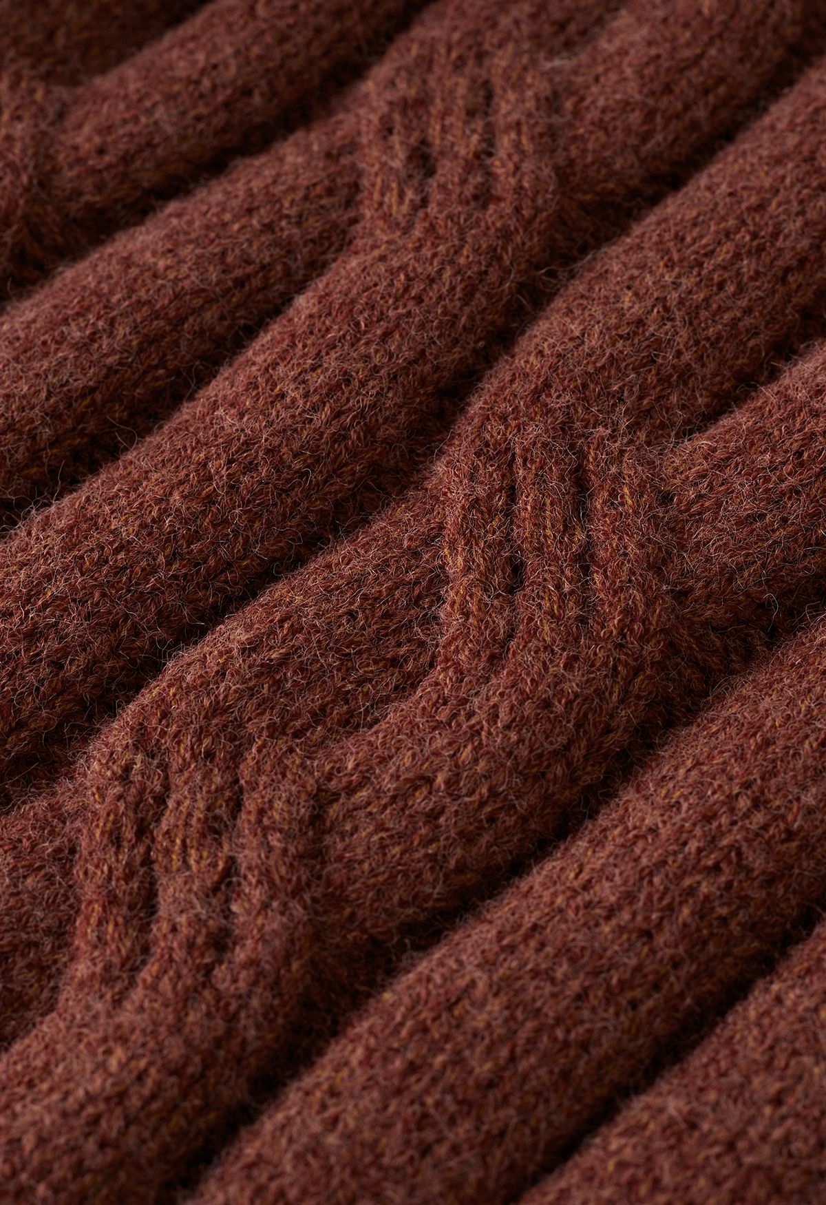 Suéter de punto con cuello redondo y textura trenzada en rojo óxido