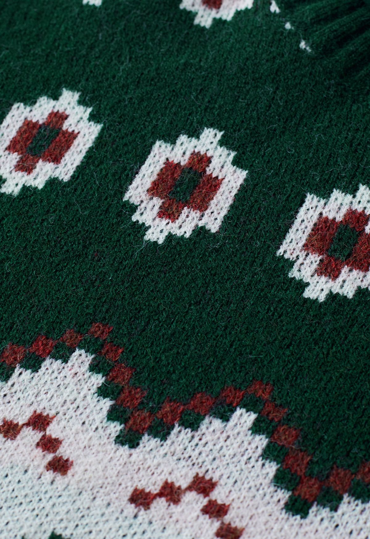 Suéter de cuello alto con bloques de color y mosaico de punto en verde