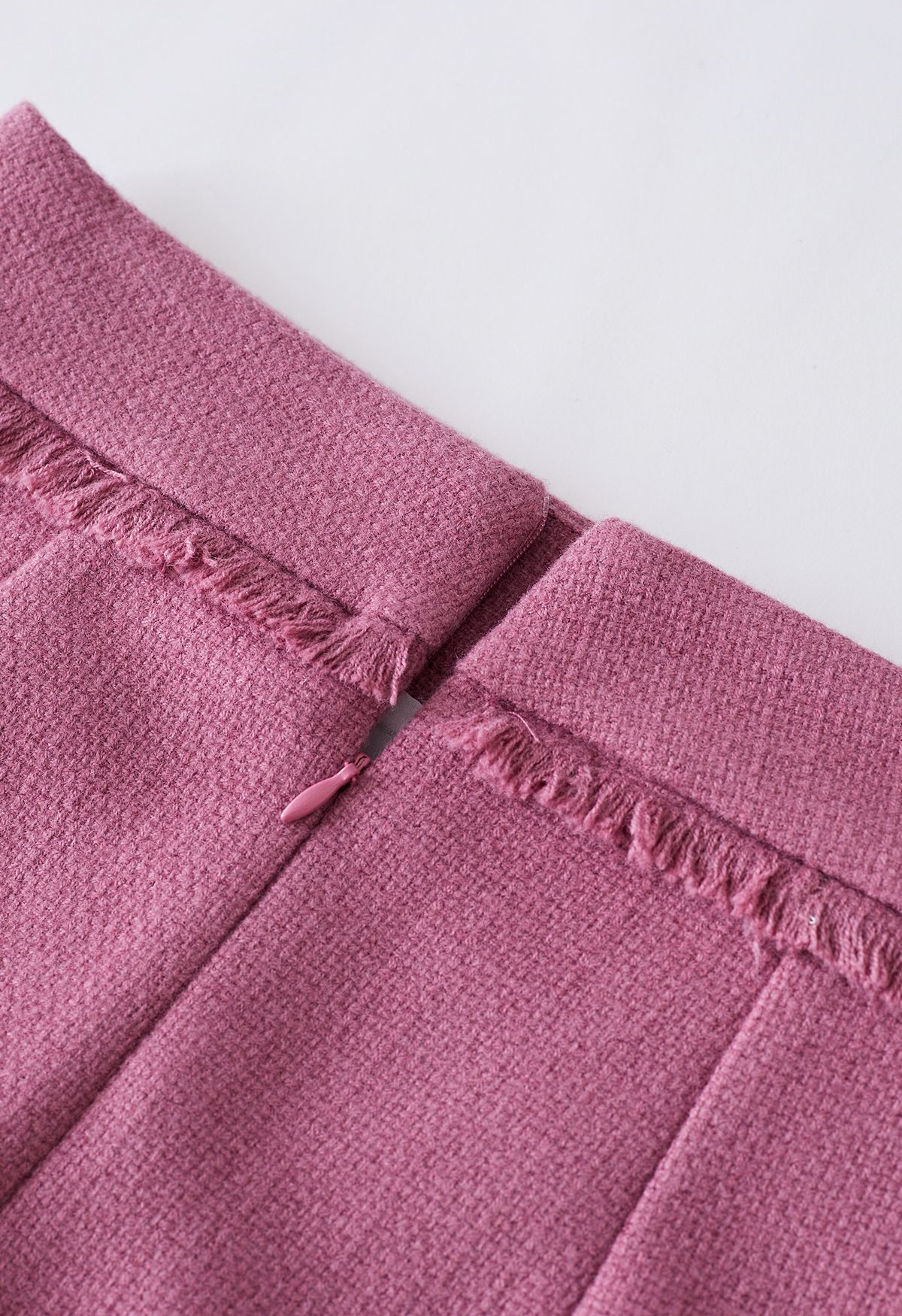 Minifalda de tweed con ribete de flecos en rosa