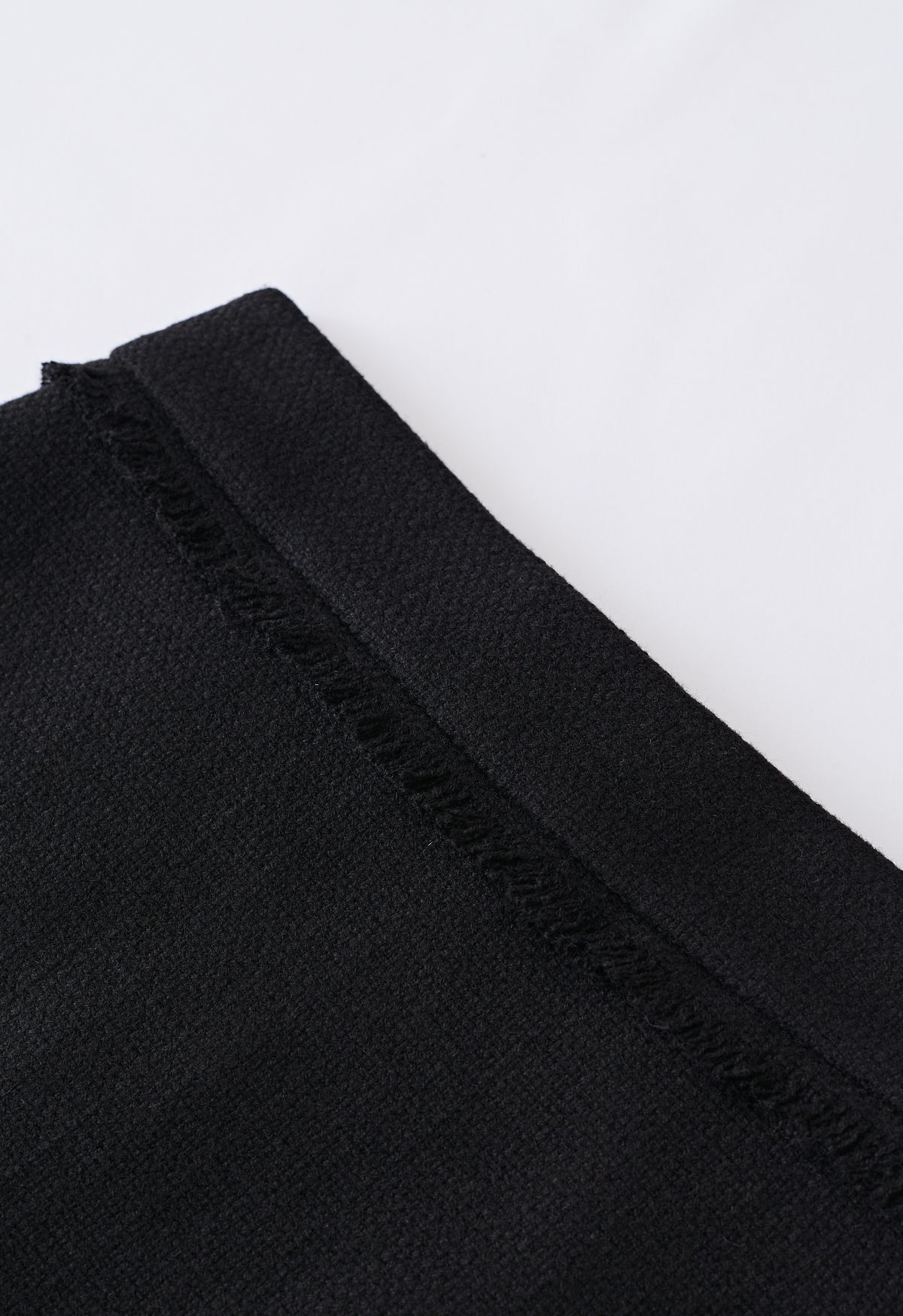 Minifalda Bud de tweed con ribete de flecos en negro