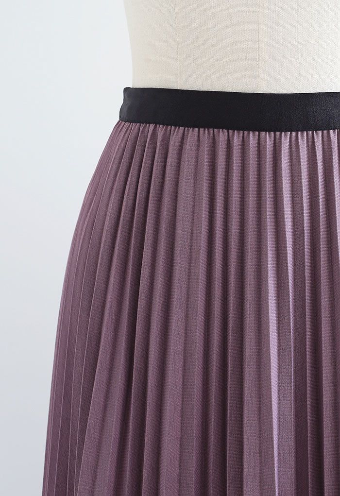 Falda plisada de malla con ribete de rombos reversible en lila