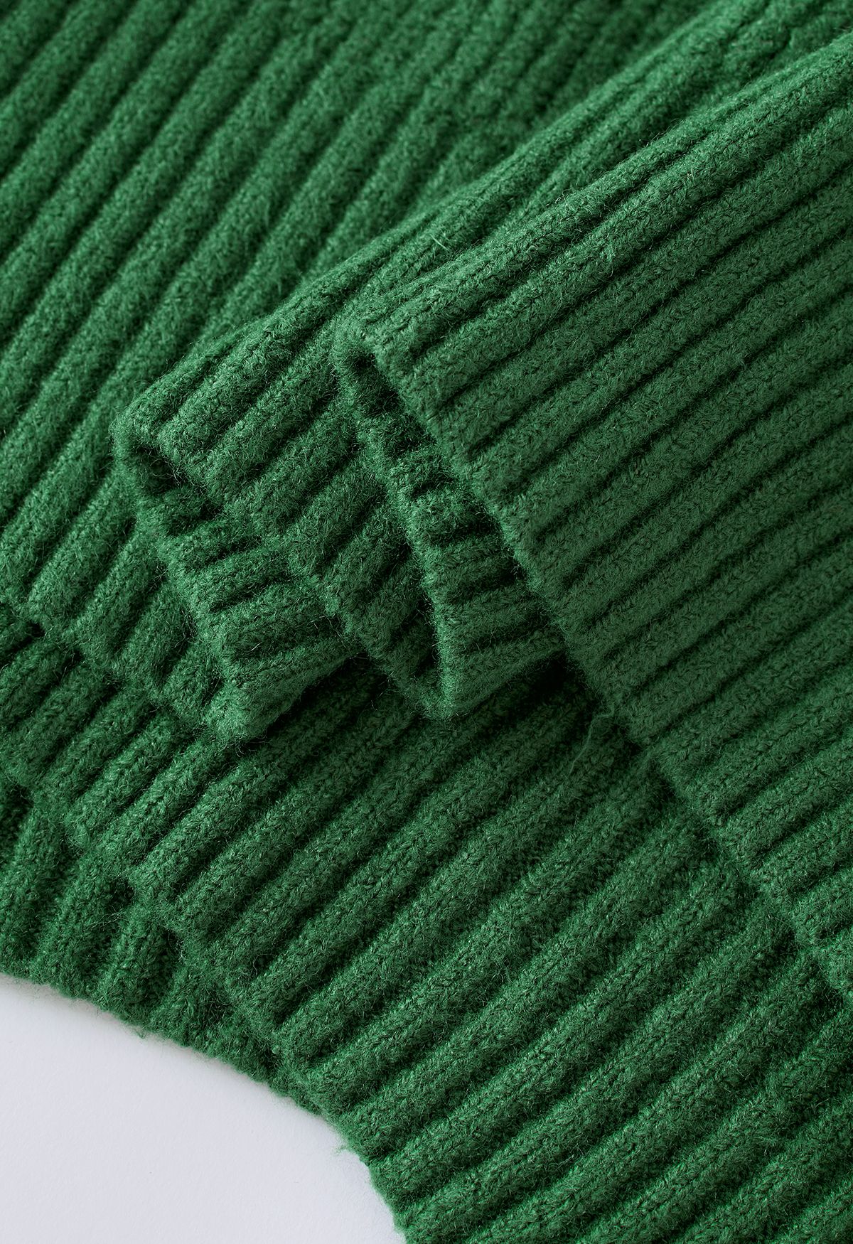 Suéter de punto con cuello redondo y nudo en verde