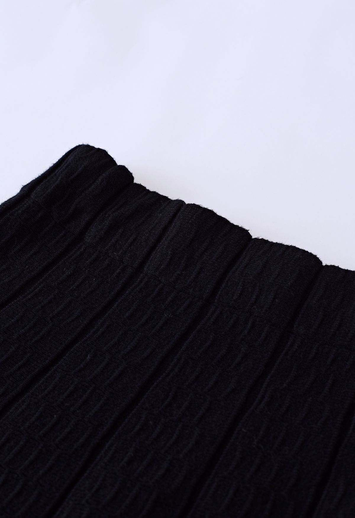 Falda con volantes de punto suave con textura en relieve en negro