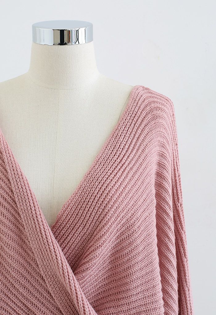 Suéter de punto con manga de murciélago en la parte delantera torcida en rosa