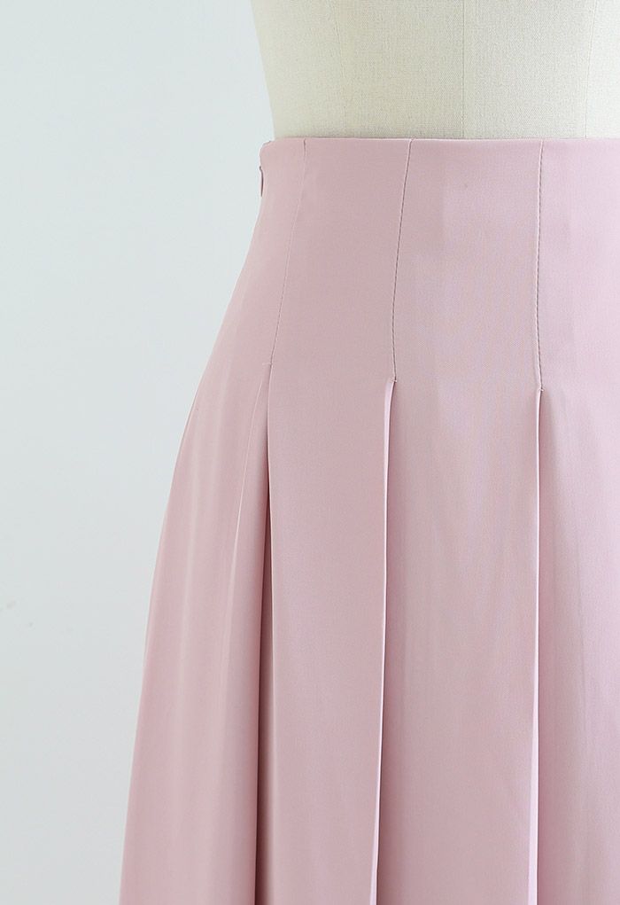 Falda larga plisada de espalda hacia adelante en rosa