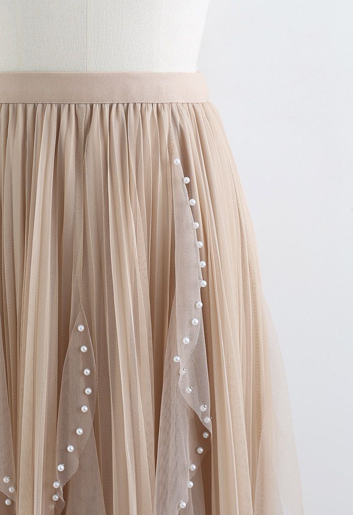 Falda de tul plisada con decoración de cuentas dispersas en tostado