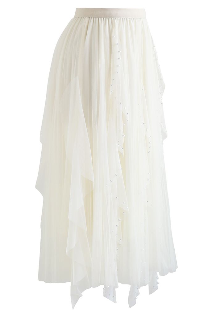 Falda de tul plisada con decoración de cuentas dispersas en color crema