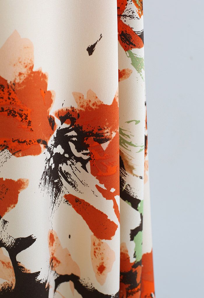 Falda midi con estampado floral abstracto en naranja