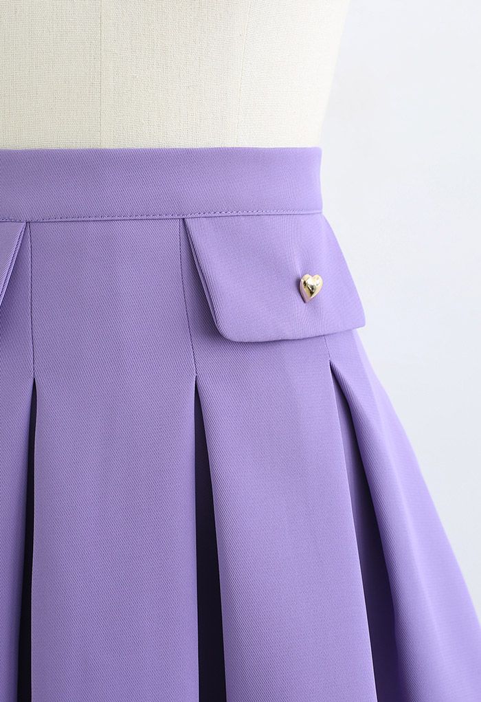 Minifalda plisada con botones de corazón pequeño en morado