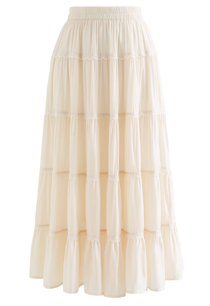 Falda midi plisada con volantes y encaje festoneado en color crema