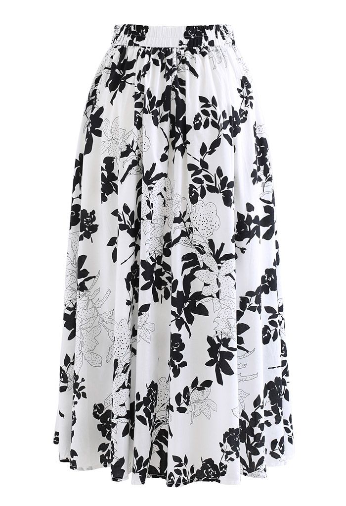 Falda midi de algodón con bolsillo lateral floral negra