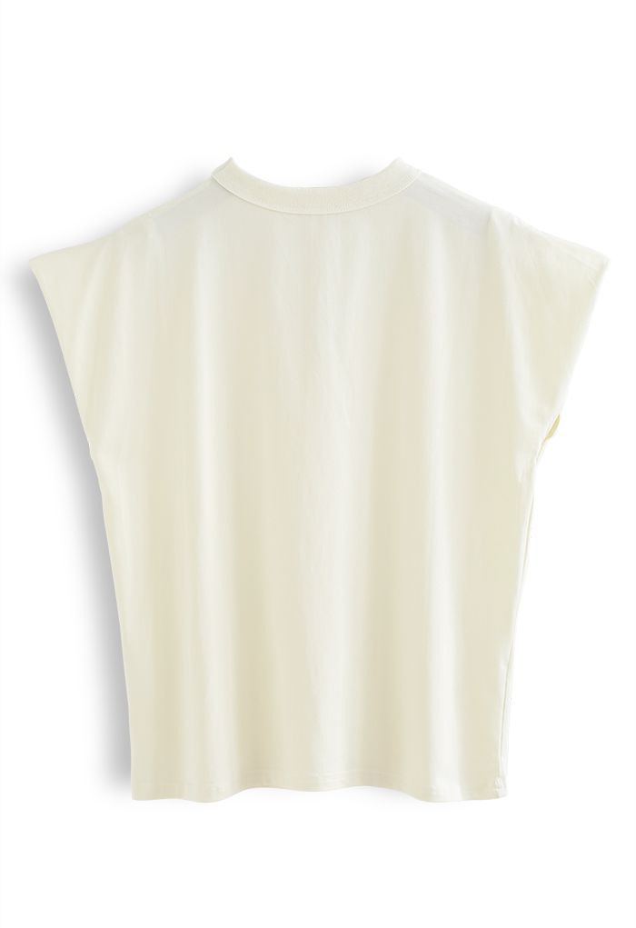 Camiseta de algodón sin mangas con cuello en V y gargantilla en color crema