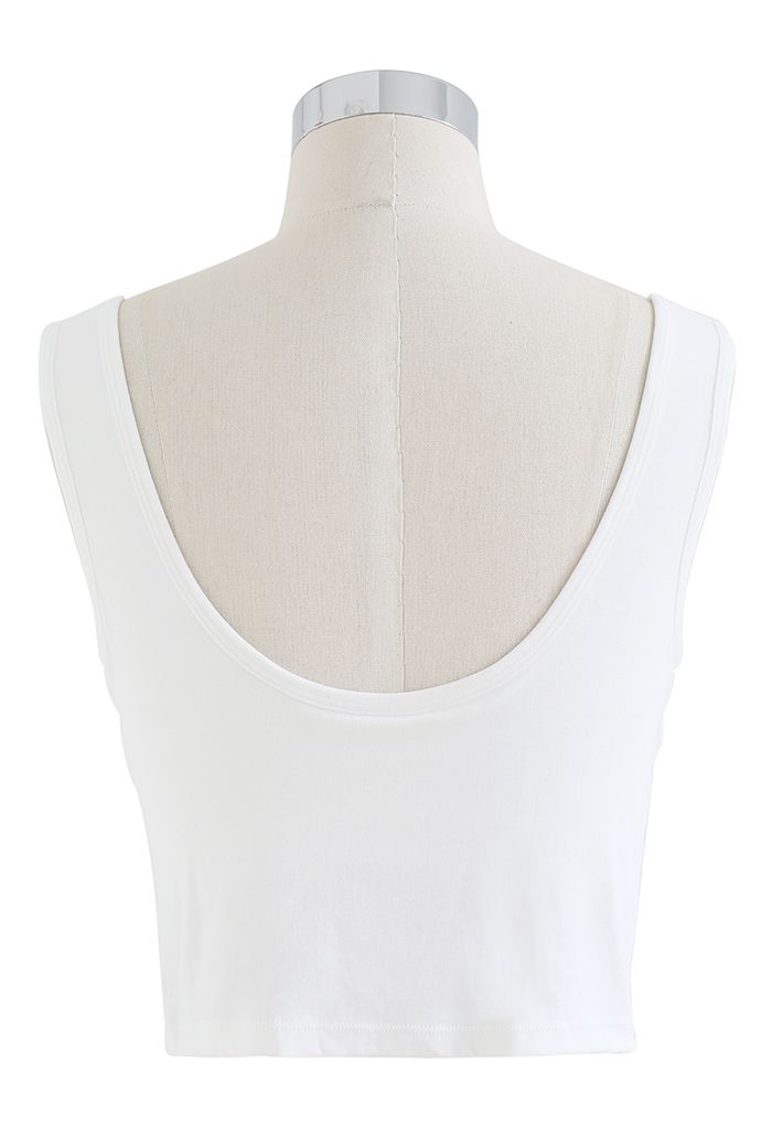 Camiseta sin mangas con bustier de color liso en blanco