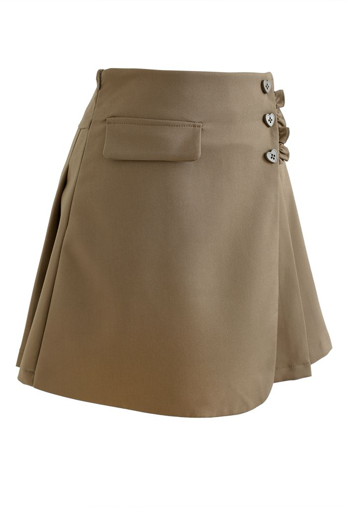Minifalda plisada con botones en forma de corazón en marrón