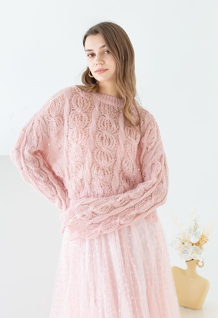 Suéter ultrasuave de punto de ochos con agujeros en rosa