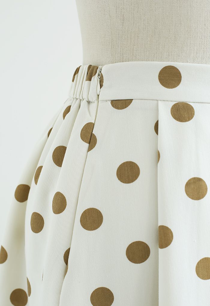 Falda midi plisada de lunares en crema