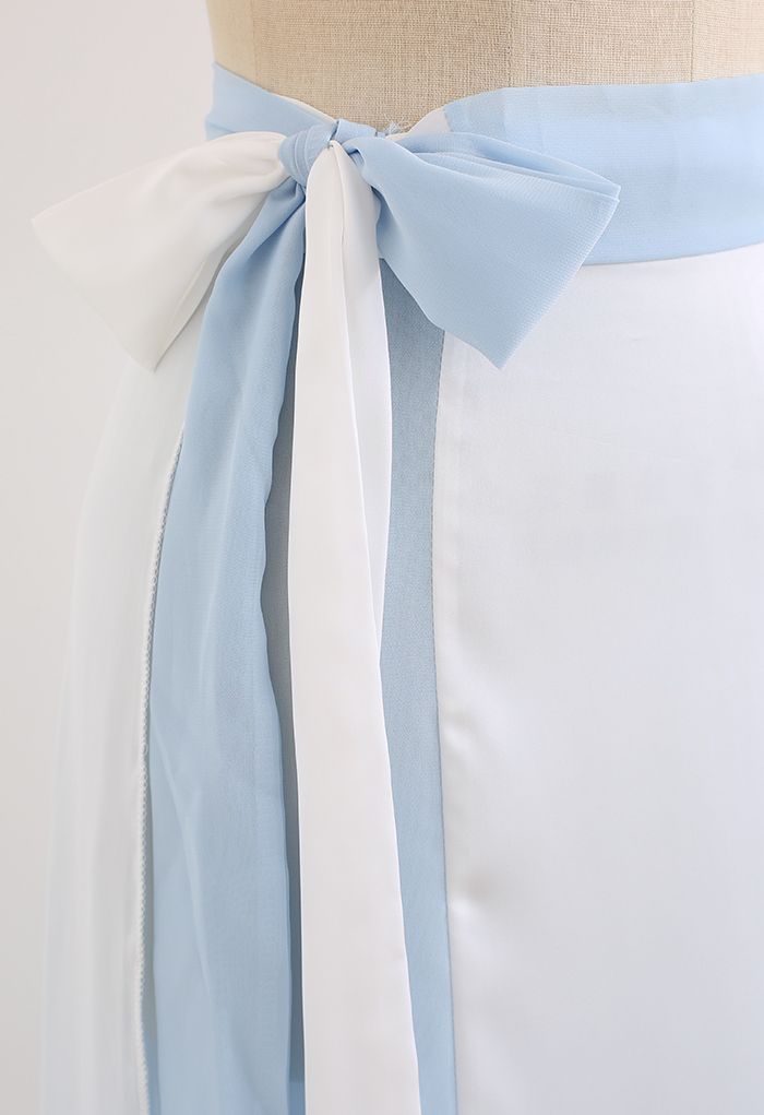 Falda larga cruzada empalmada con lazo en la cintura en azul bebé