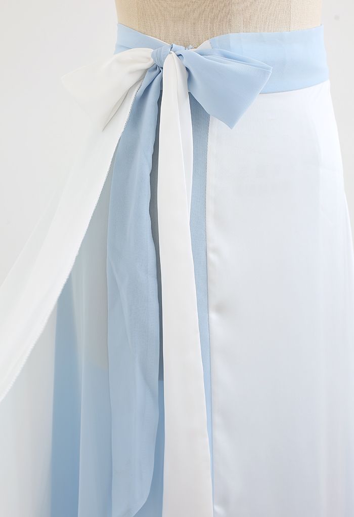 Falda larga cruzada empalmada con lazo en la cintura en azul bebé