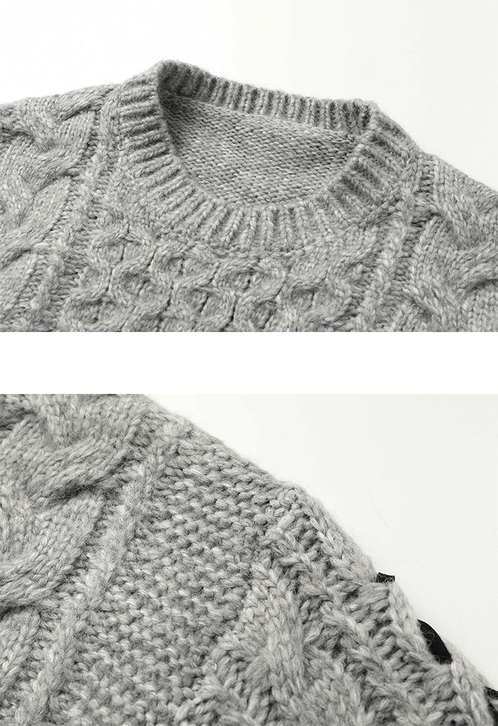Suéter corto de punto trenzado con mangas con cordones en gris