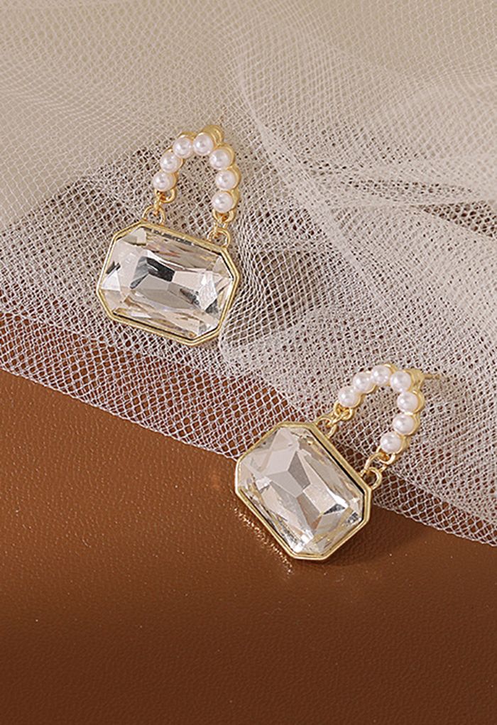 Aretes de perlas con candado de cristal