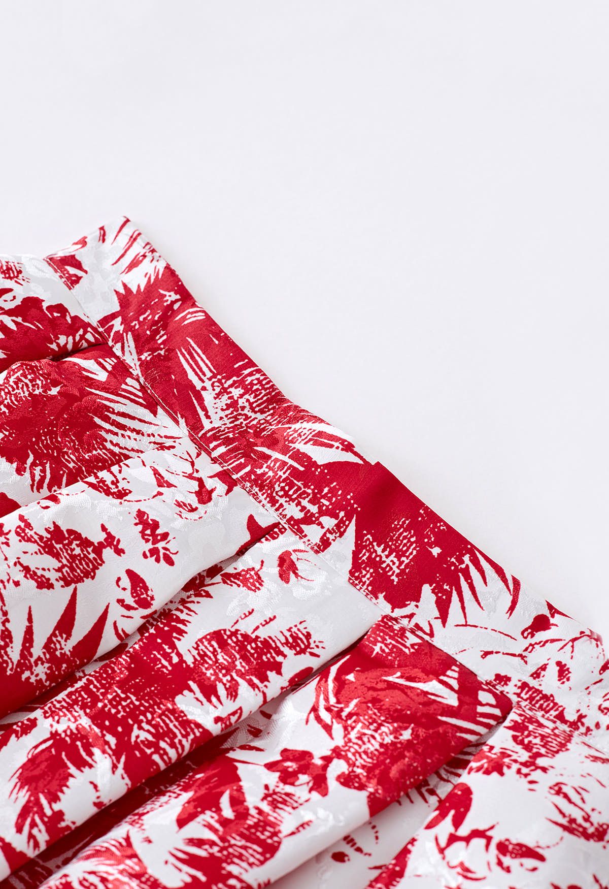 Falda midi plisada de jacquard con surcos tropicales en rojo