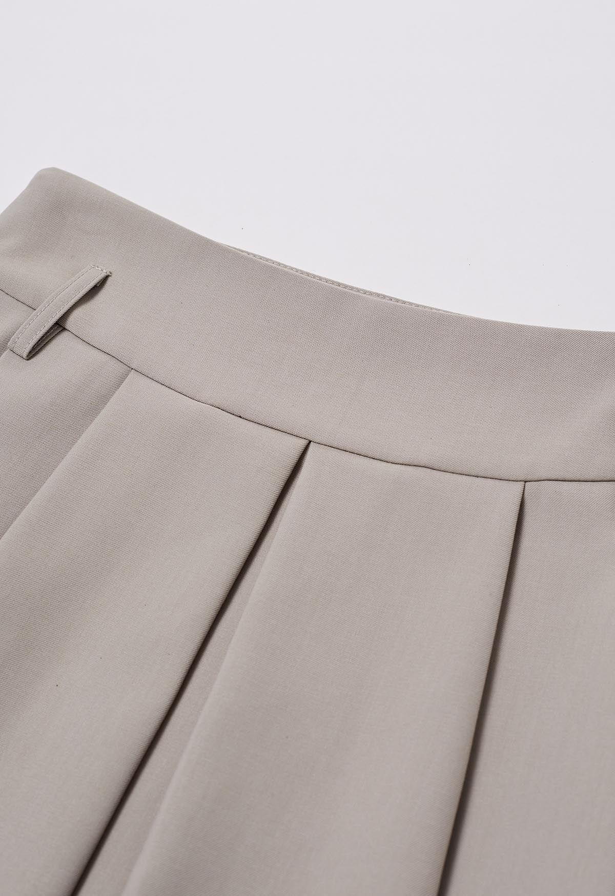 Falda pantalón plisada con dobladillo en contraste en color topo