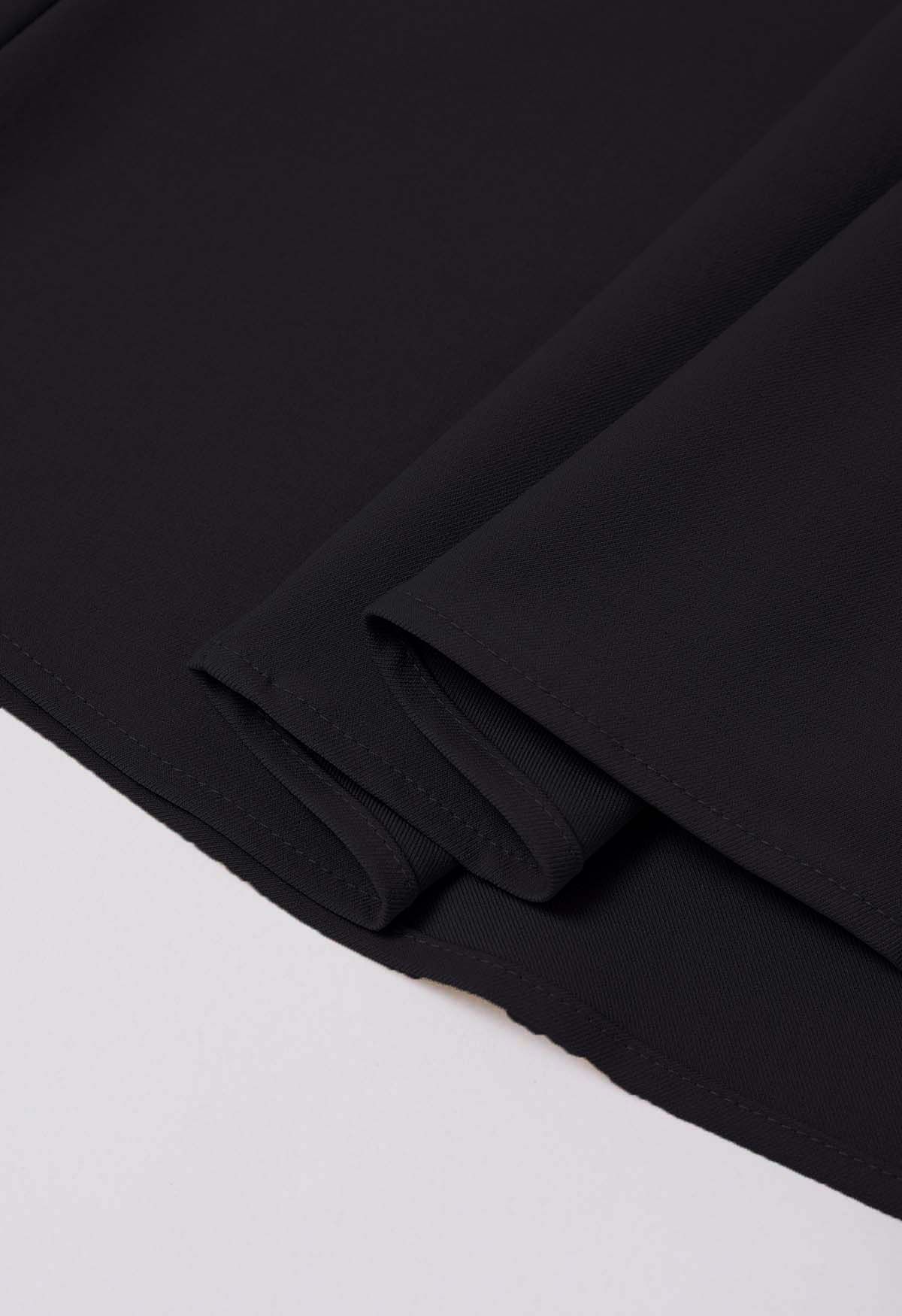 Falda midi plisada con cintura adornada con botones en negro