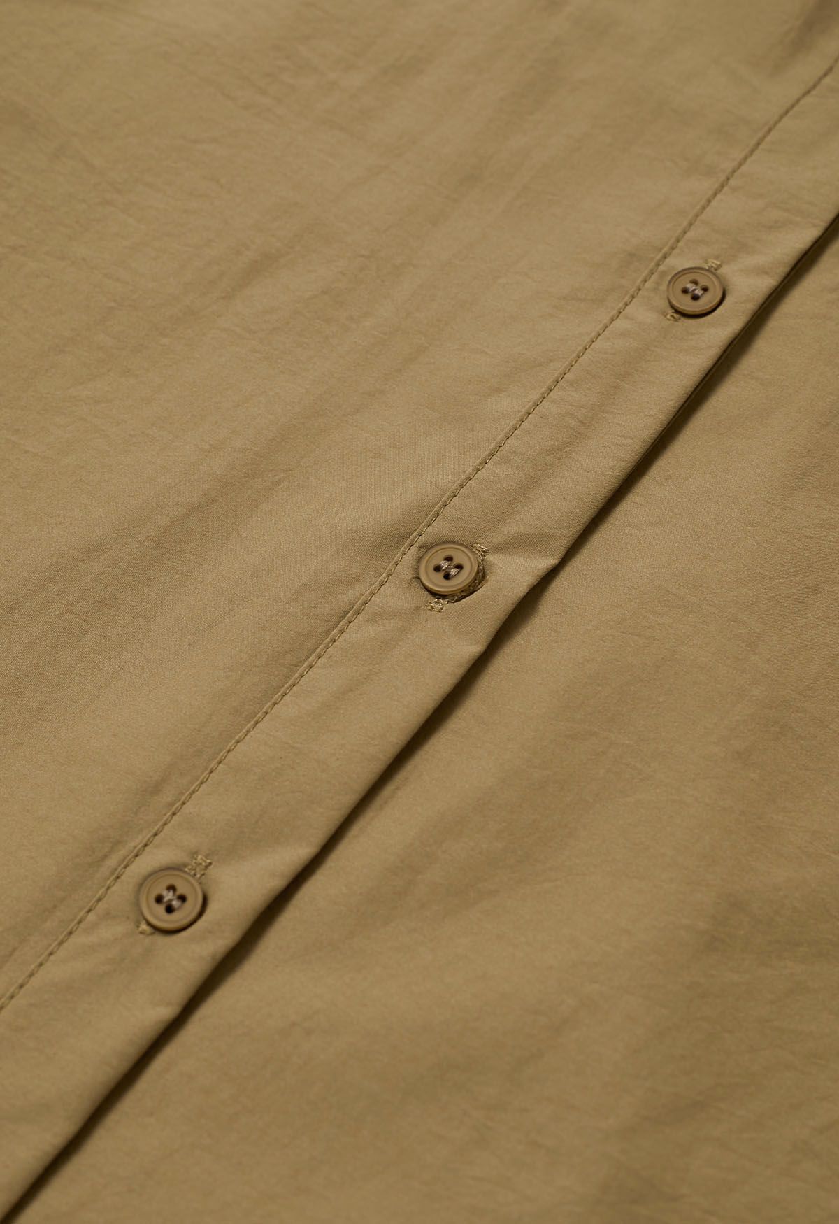 Camisa de puro algodón con dobladillo asimétrico en color camel