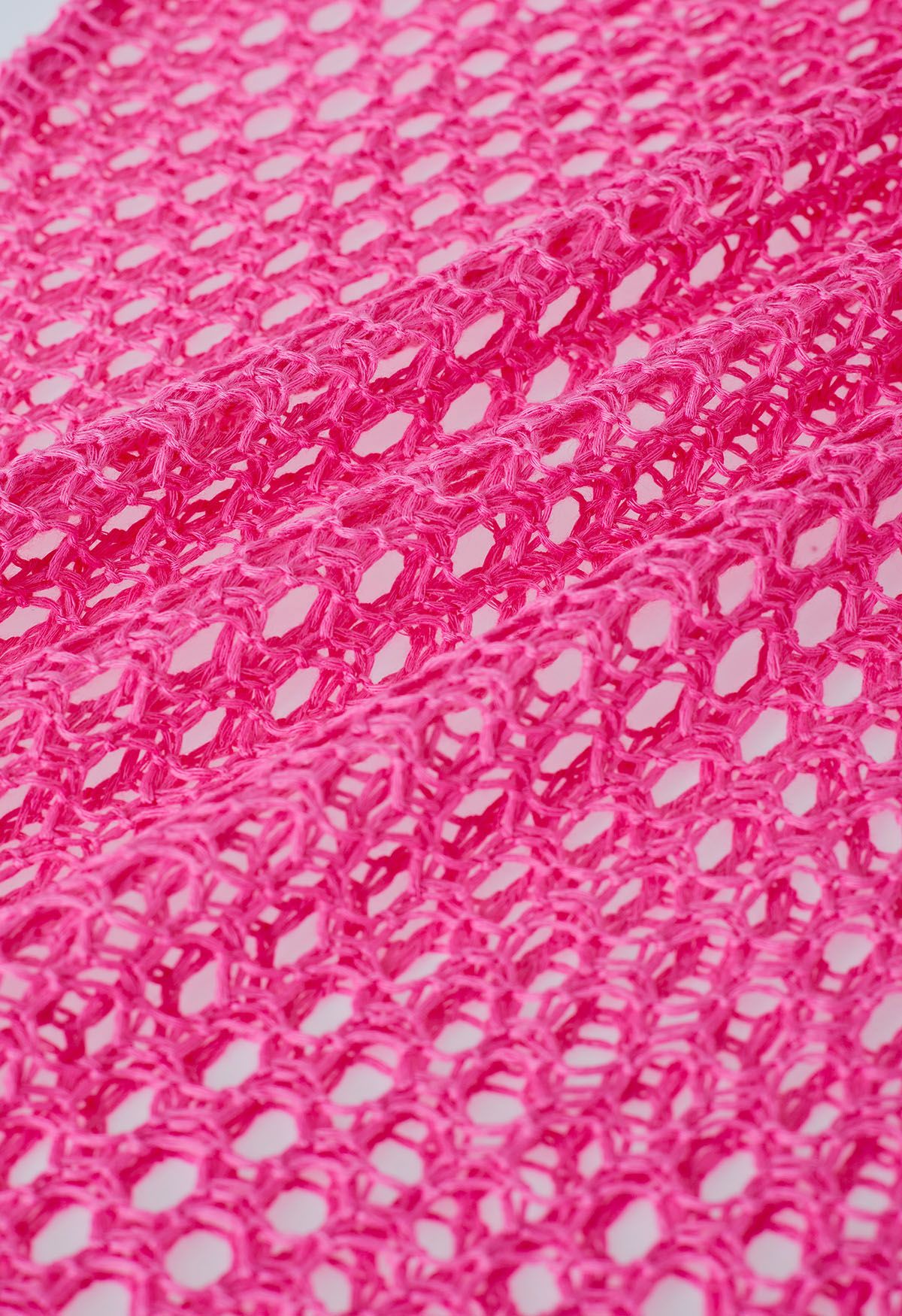 Cubierta de punto sin mangas con dobladillo con borlas en rosa intenso