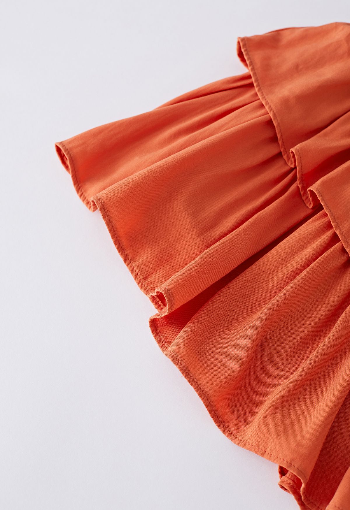 Minifalda de cintura fruncida con volantes escalonados en naranja