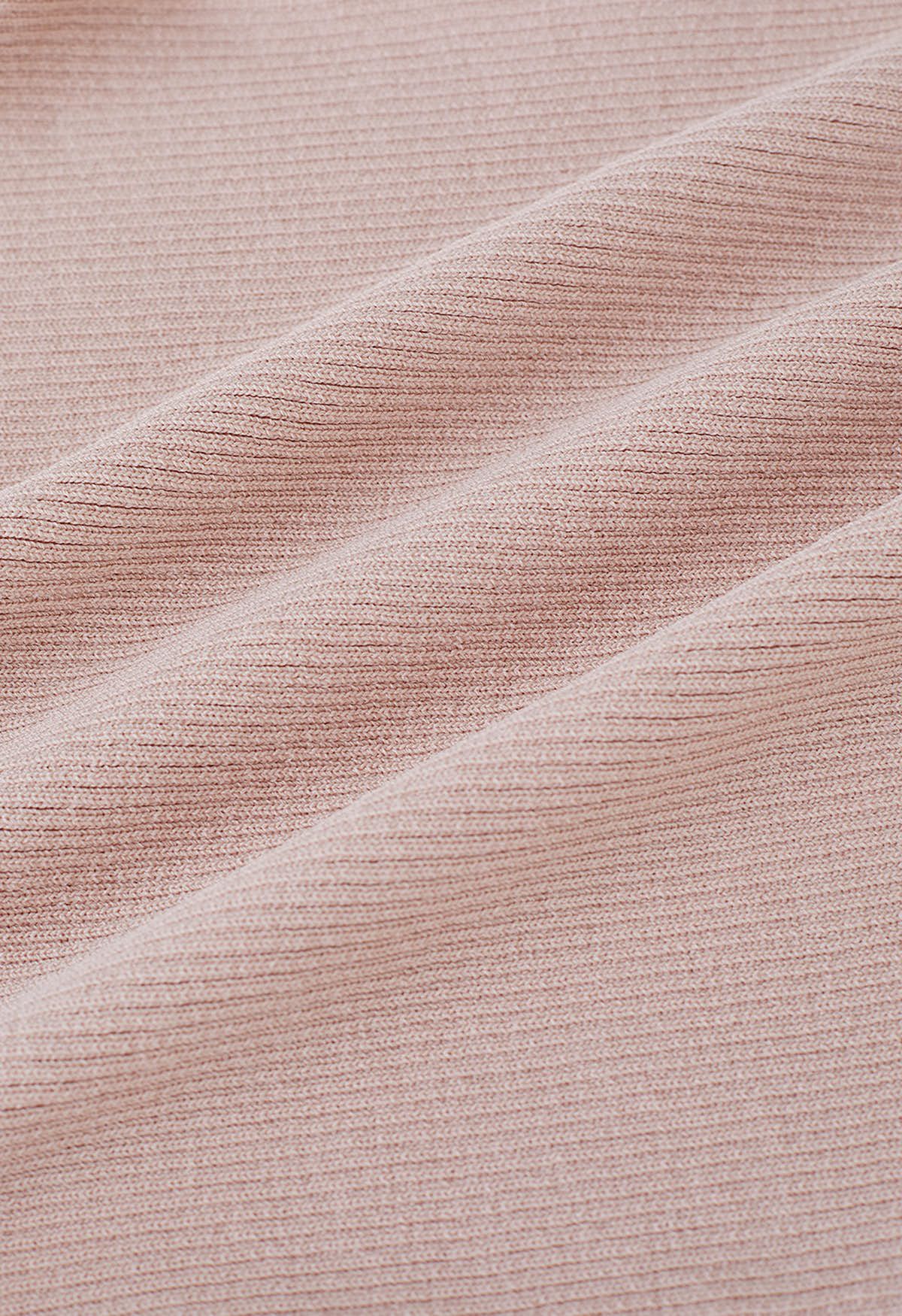 Top corto de punto con mangas onduladas escalonadas empalmadas en rosa