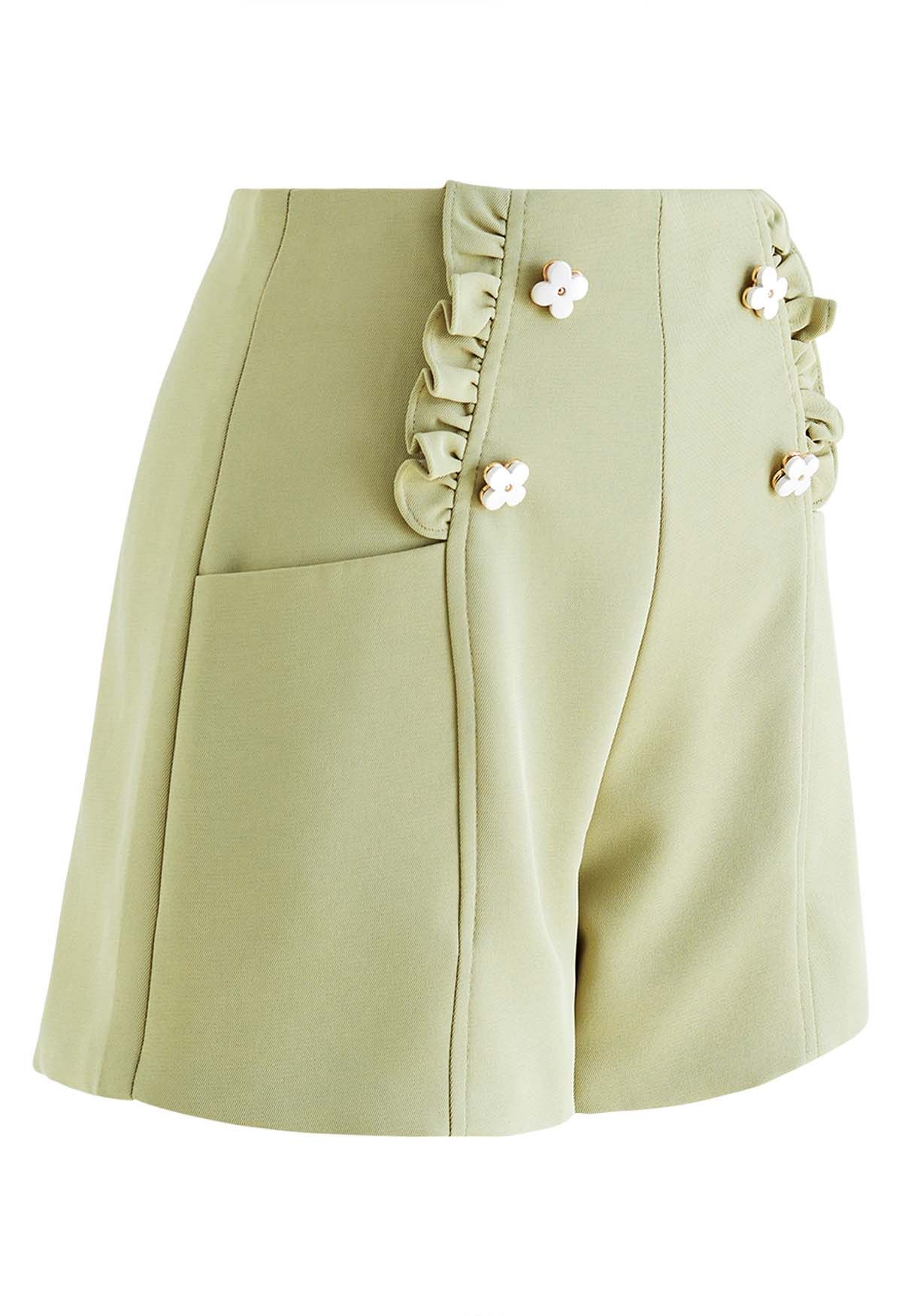 Adorables pantalones cortos con ribete de volantes de flores en verde guisante