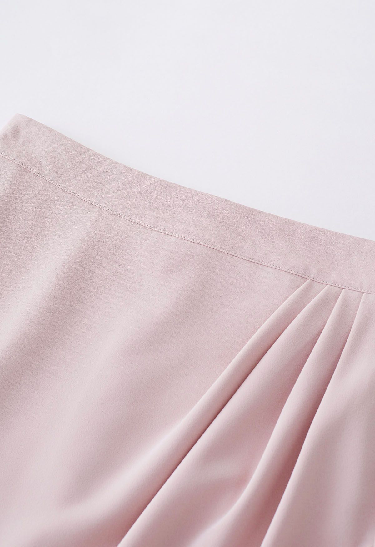 Falda midi tulipán con pliegues laterales en rosa