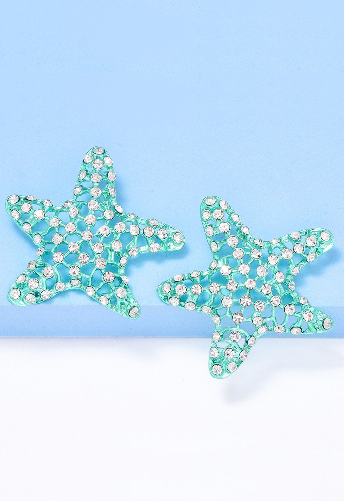 Aretes de estrella de mar con circonitas huecas en menta