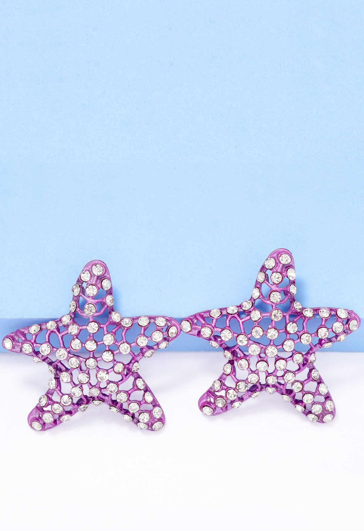 Pendientes de estrella de mar con circonitas huecas en morado