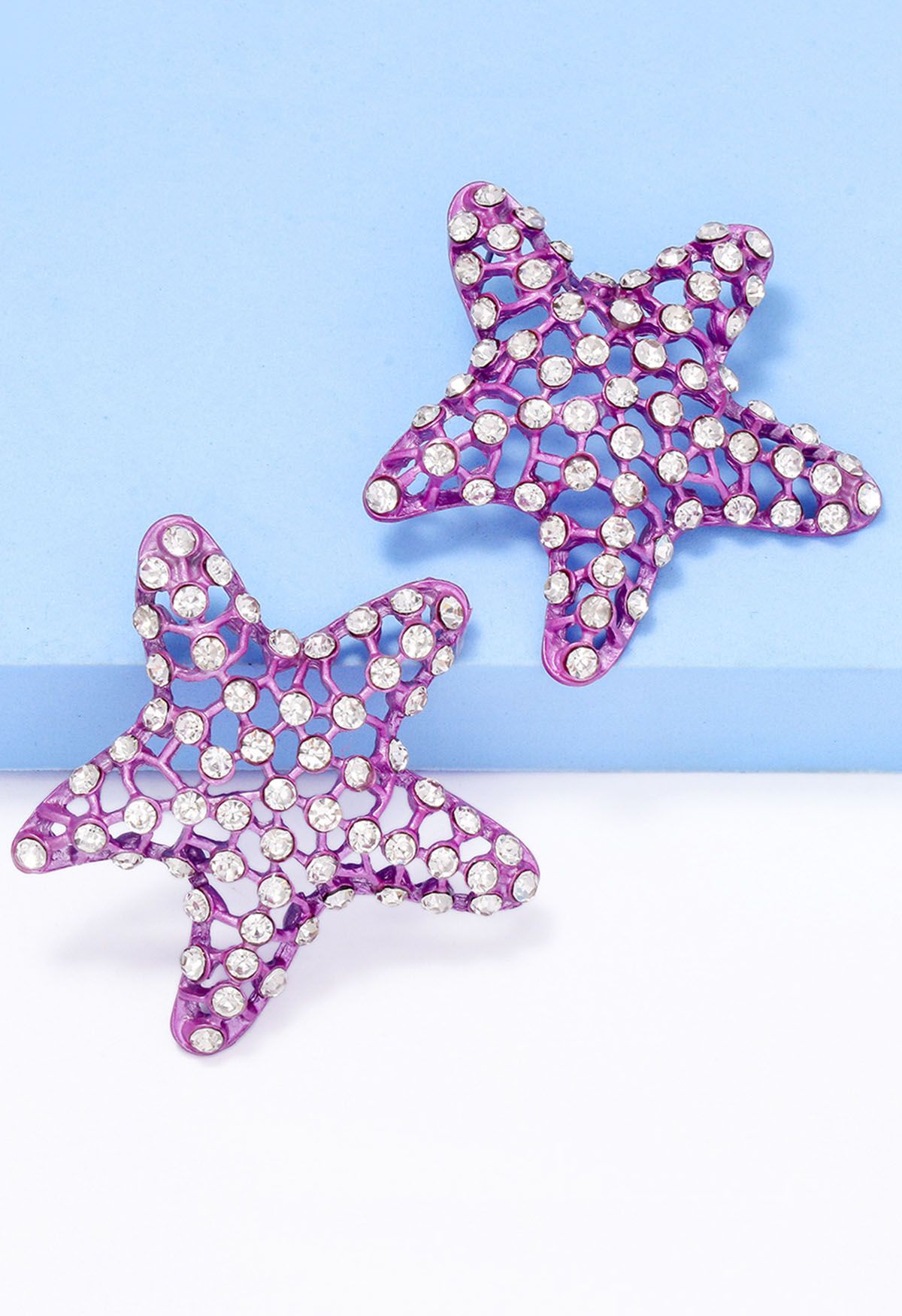 Pendientes de estrella de mar con circonitas huecas en morado