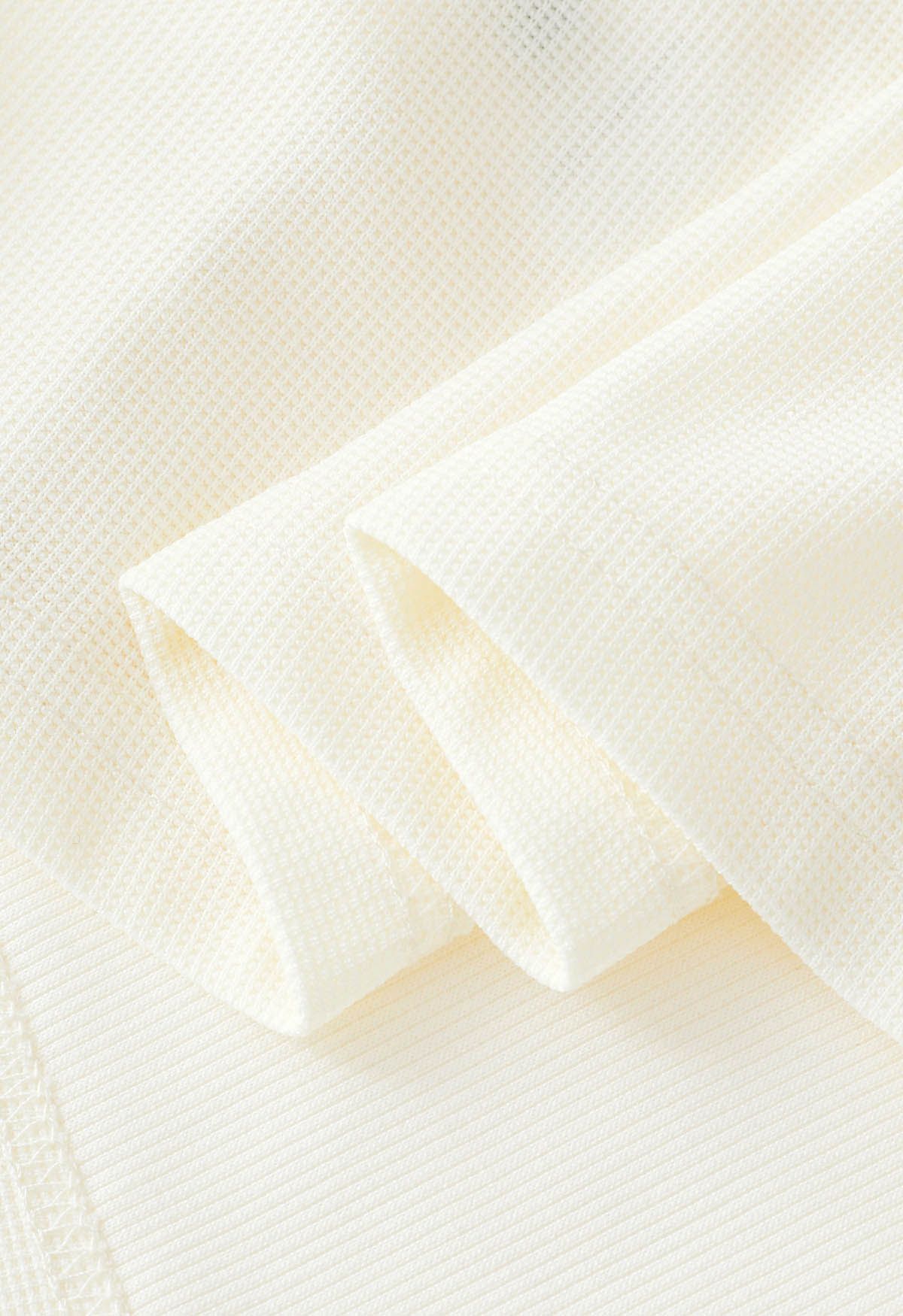 Top sin mangas de algodón con cintura cruzada en color crema