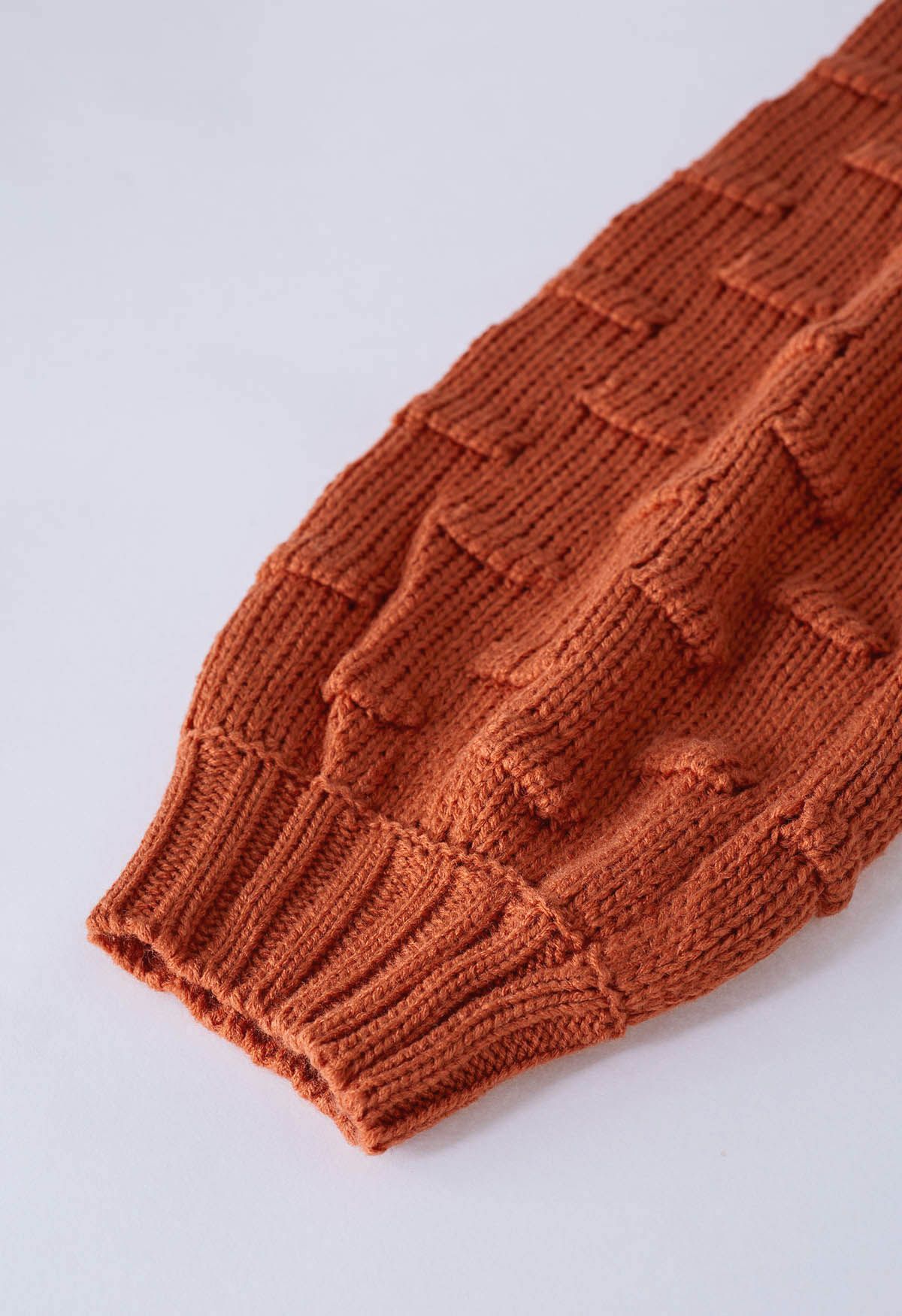 Suéter corto con mangas abullonadas y puntos juguetones en color calabaza