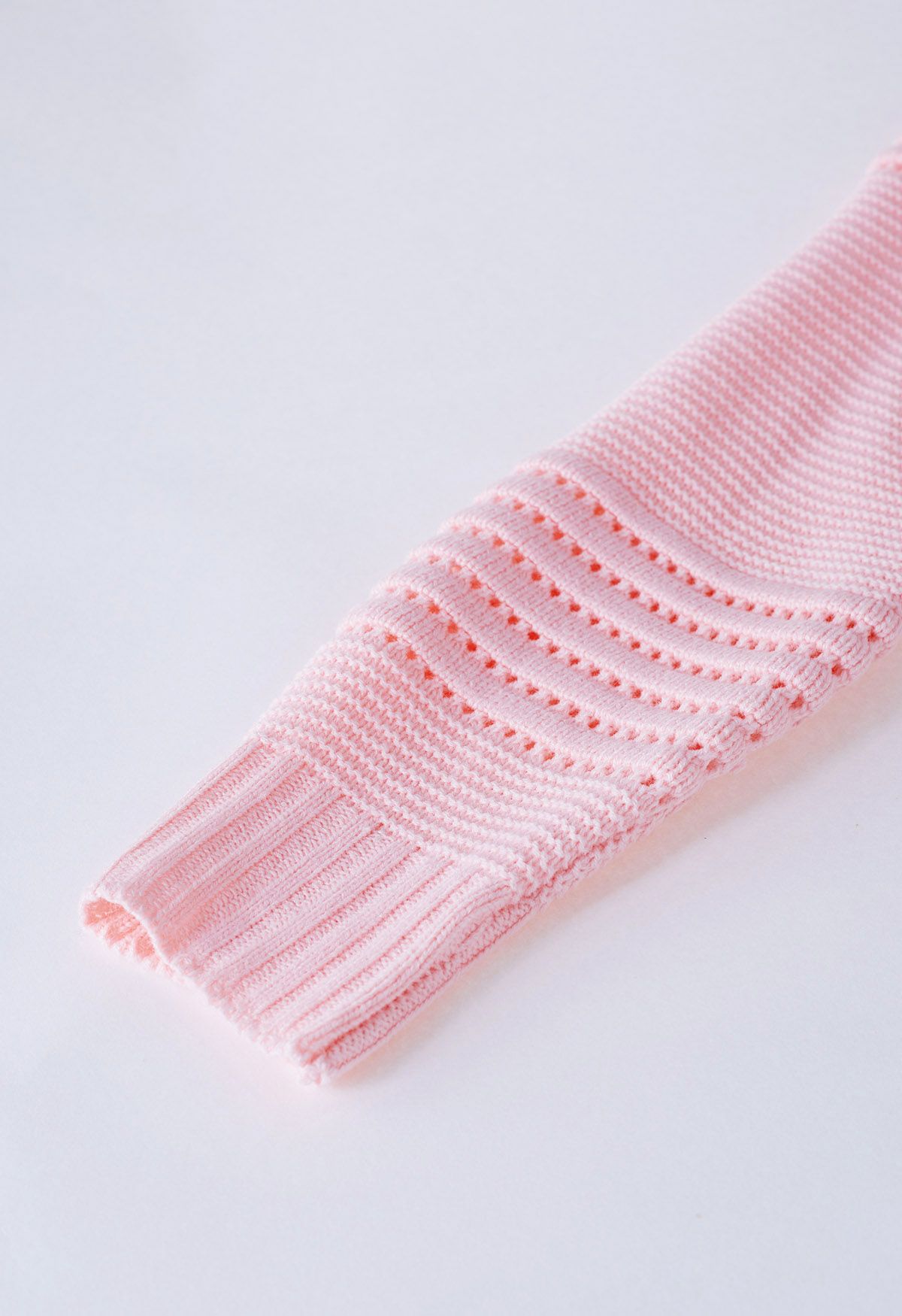 Jersey de punto calado con rayas en relieve en rosa