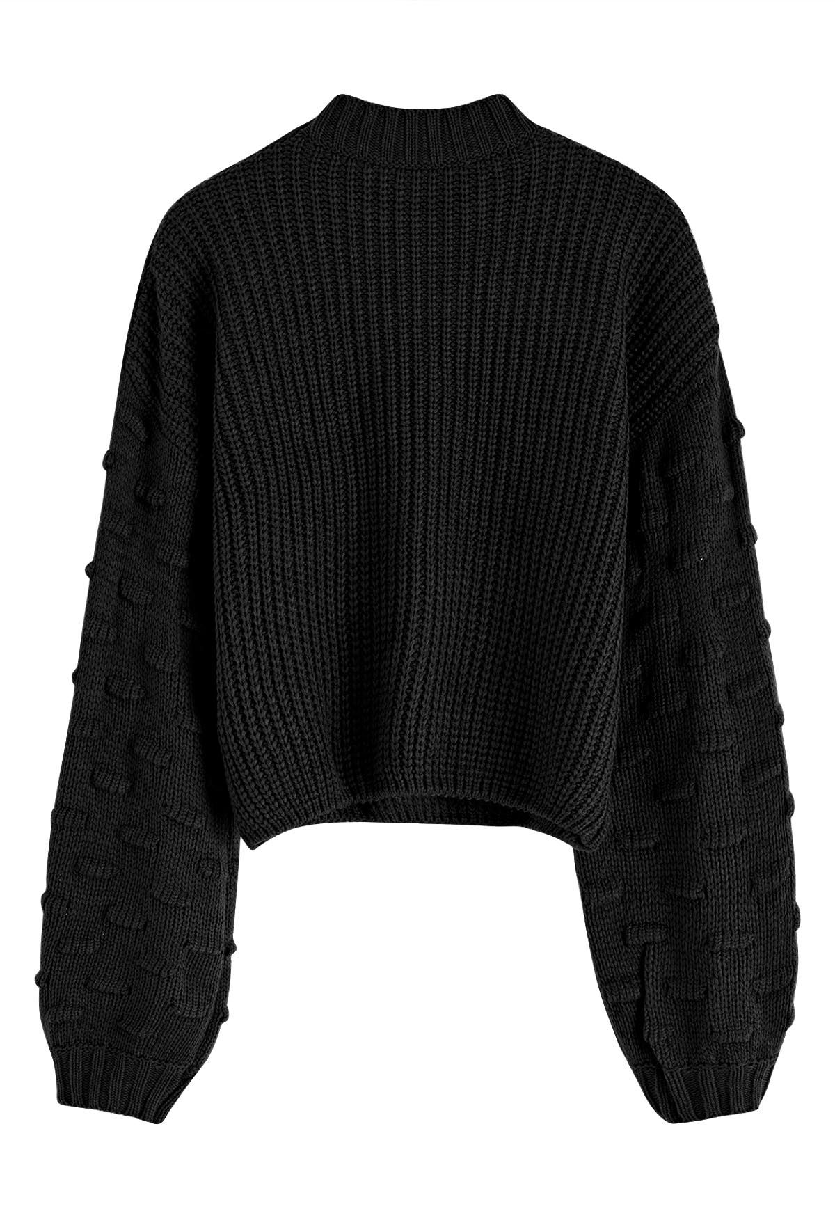 Suéter corto con mangas abullonadas y puntos juguetones en negro