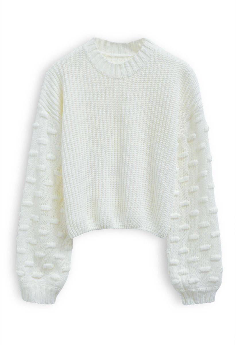 Suéter corto con mangas abullonadas y puntos juguetones en blanco