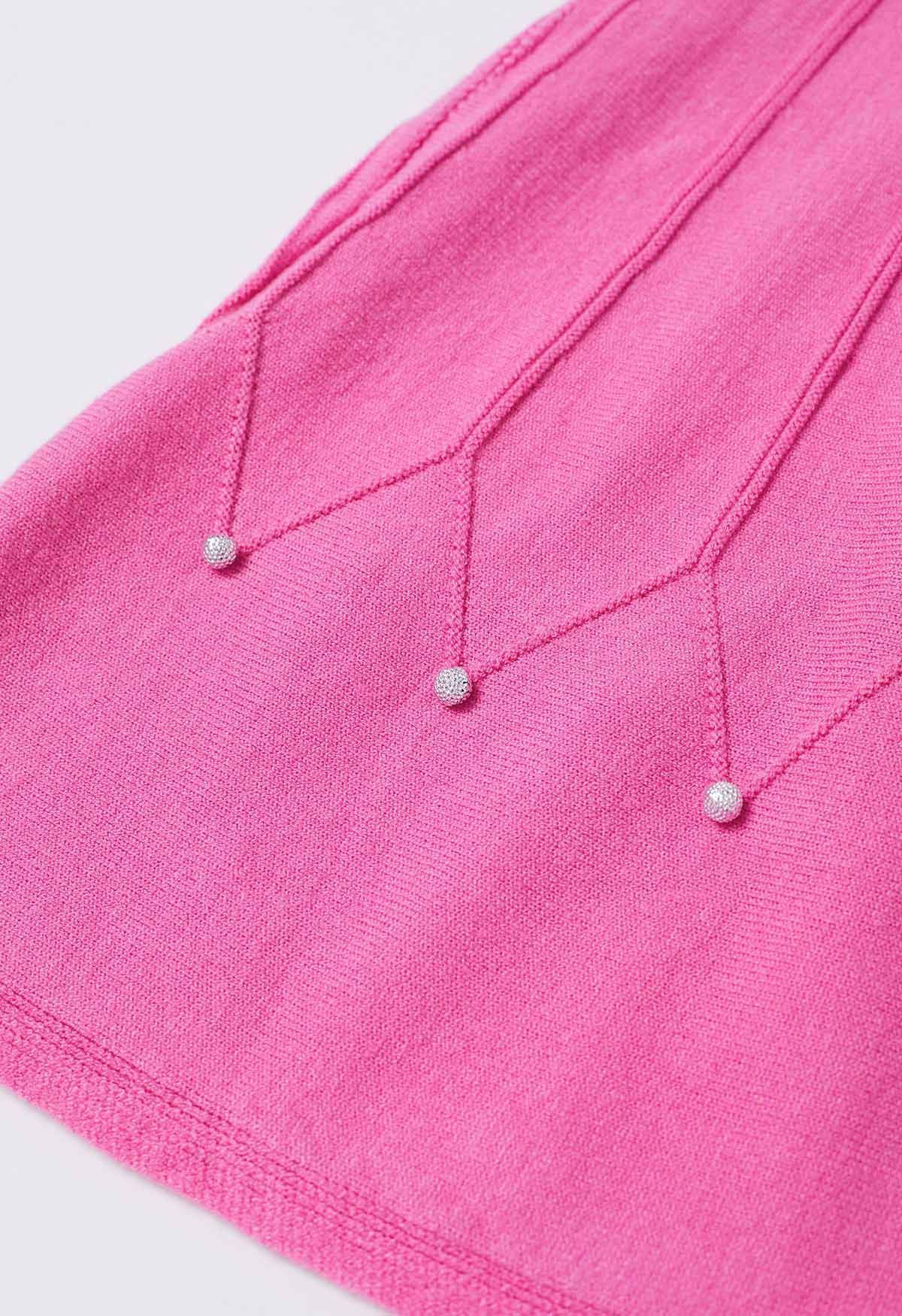Falda de punto con costuras adornadas con cuentas plateadas en color magenta
