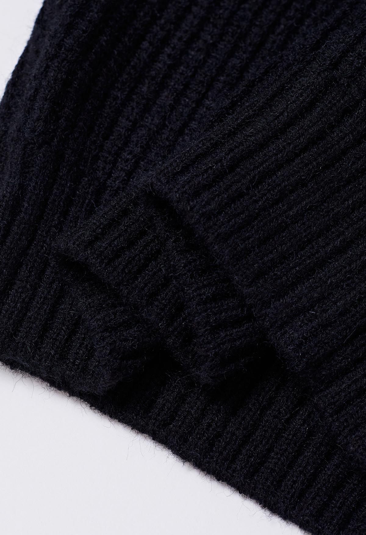 Suéter de punto de manga corta con cuello simulado en negro
