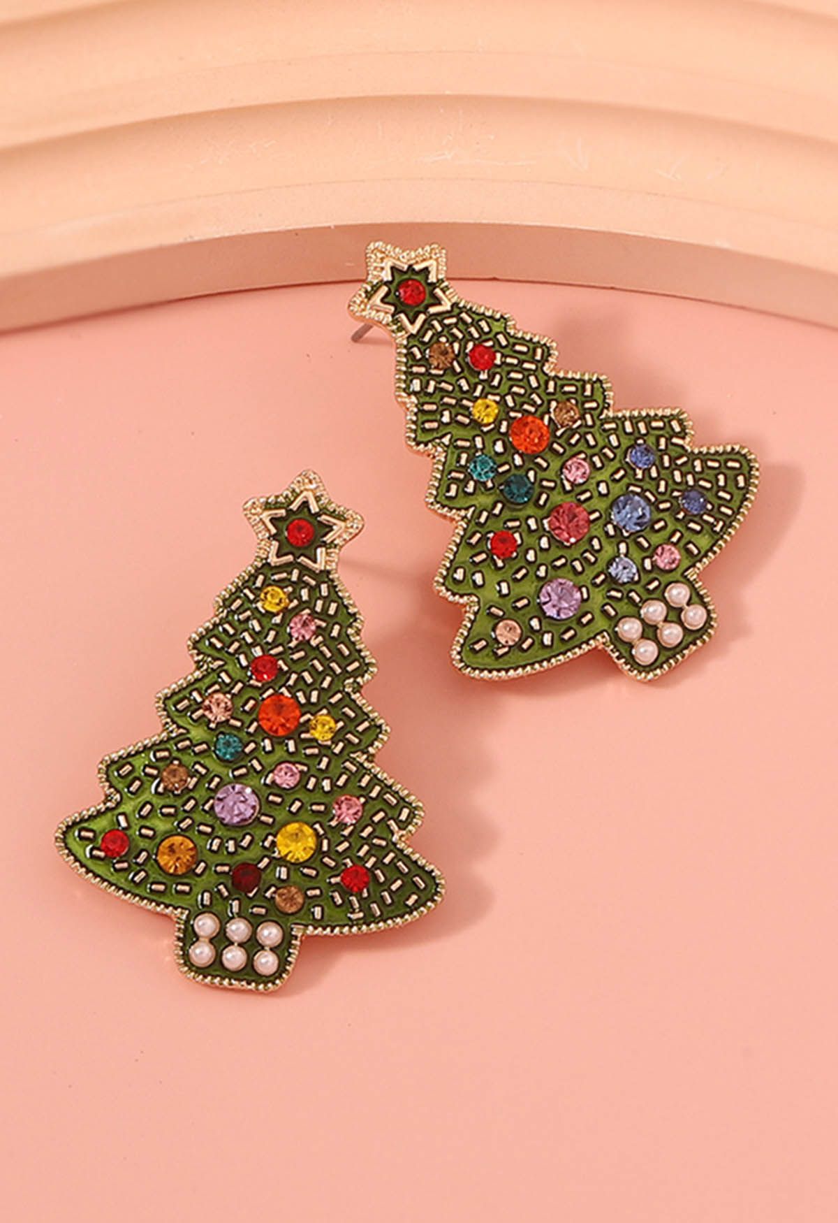 Pendientes de árbol de Navidad con diamantes de imitación derramados con aceite