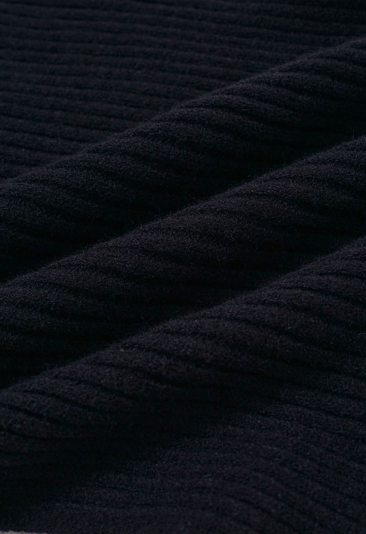 Dramático suéter de punto acanalado con mangas de murciélago en negro